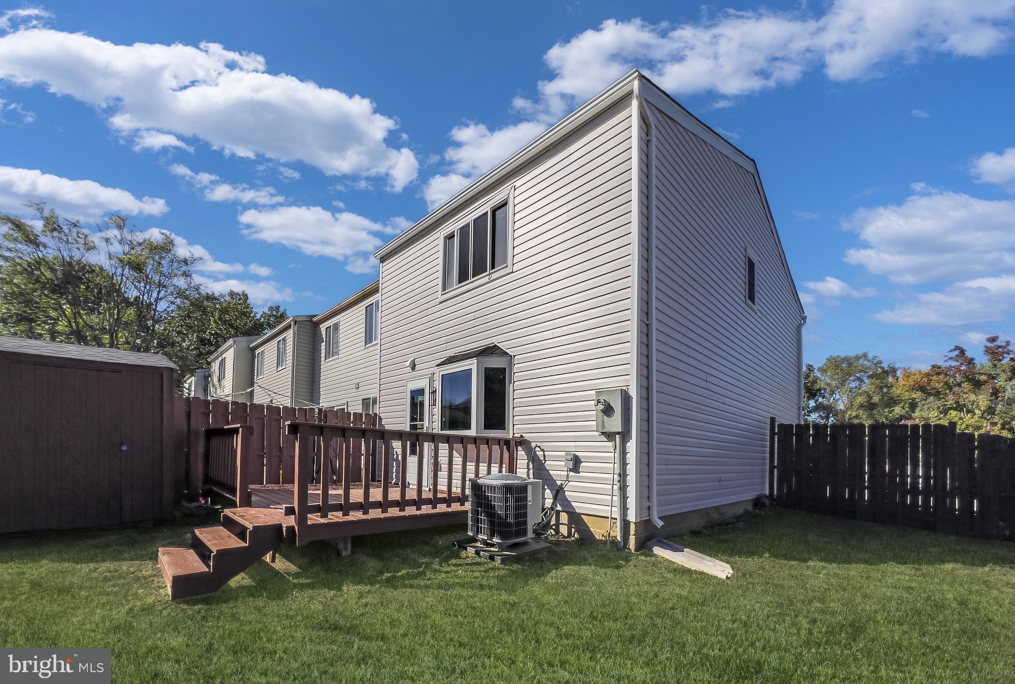 3681 Masthead Trail Triangle, VA 22172 - Photo 34 of 40 a view of a house with a backyard and deck