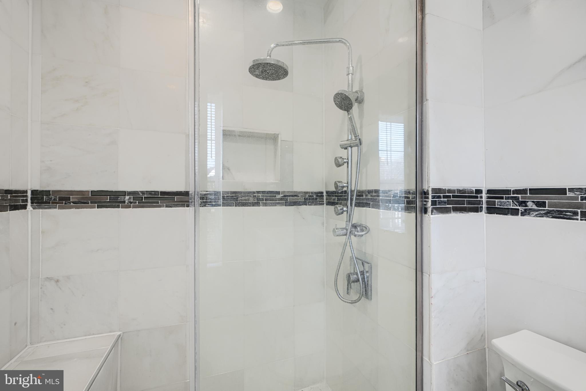 703 George Street Baltimore, MD 21201 - Photo 20 of 27 Sleek modern shower with elegant finishes.