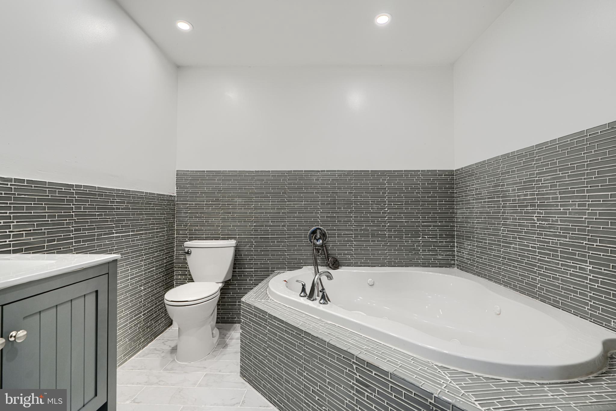 703 George Street Baltimore, MD 21201 - Photo 23 of 27 Modern bathroom with elegant tile accents.