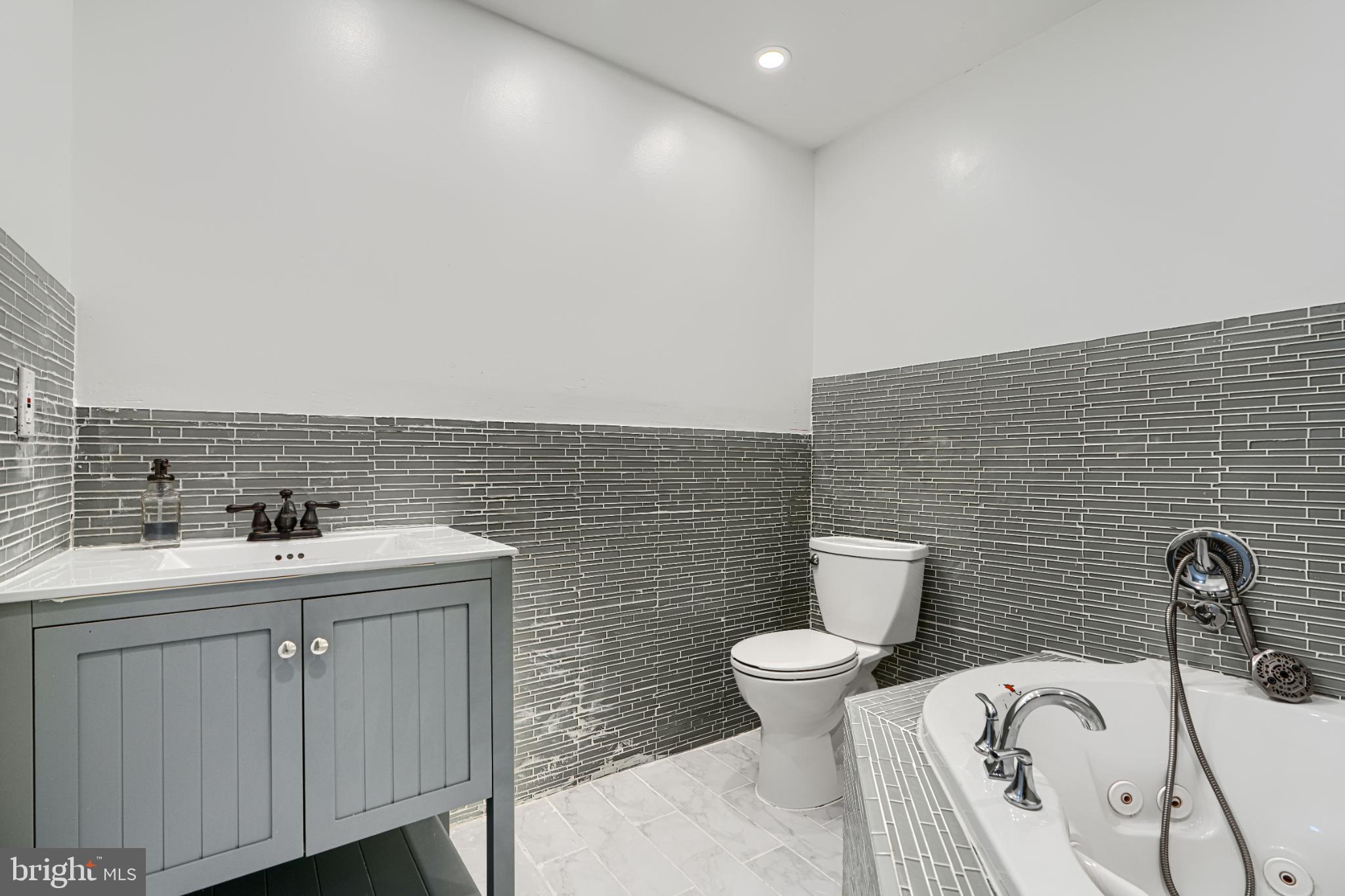 703 George Street Baltimore, MD 21201 - Photo 24 of 27 Sleek modern bathroom with stylish tiles.