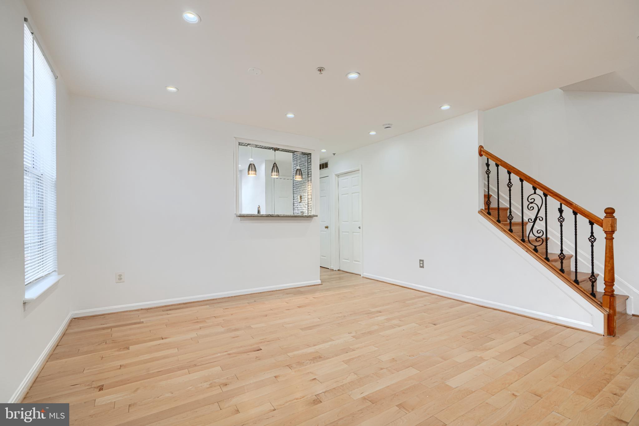 703 George Street Baltimore, MD 21201 - Photo 4 of 27 Bright and airy living space with elegant stairs.