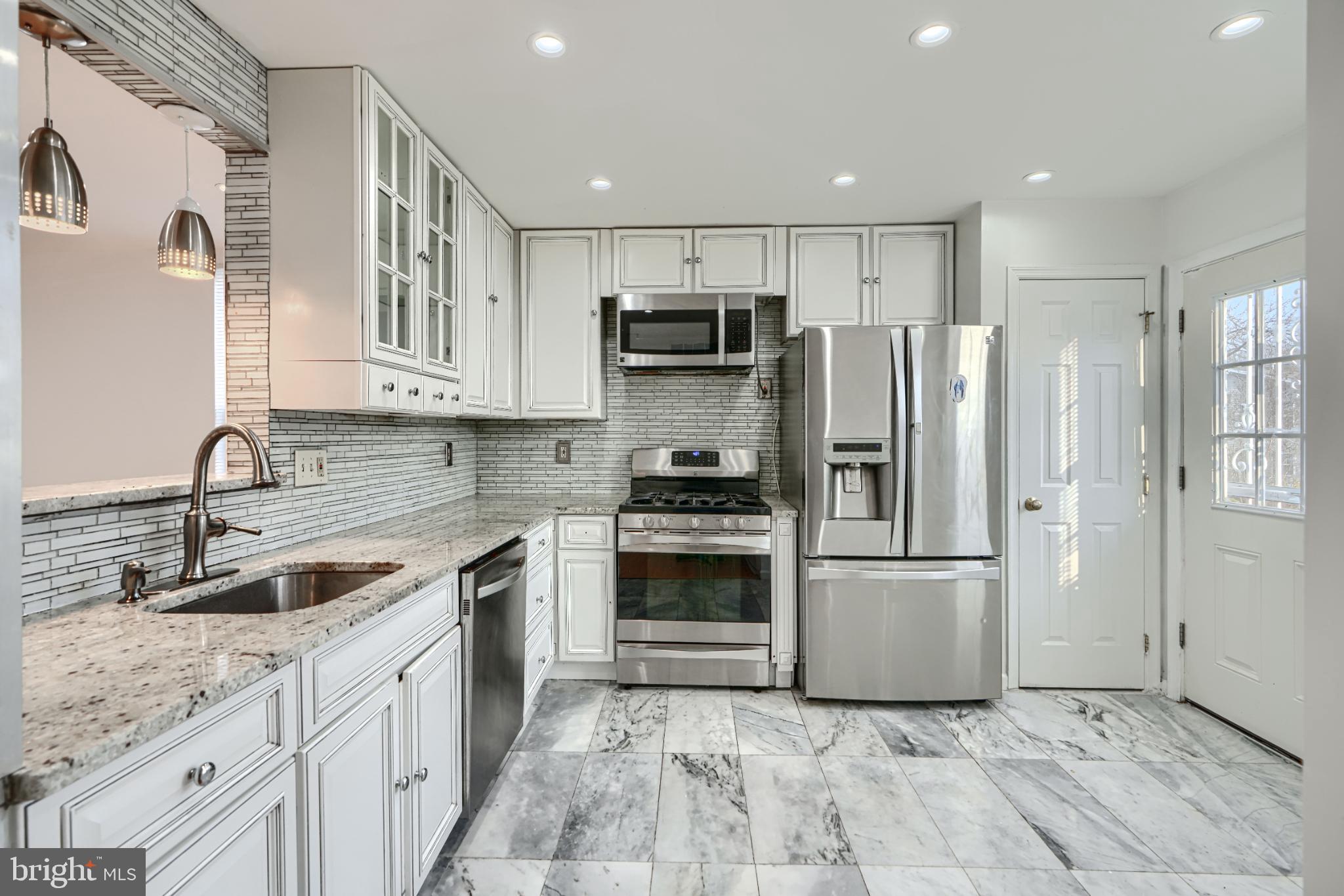 703 George Street Baltimore, MD 21201 - Photo 6 of 27 Modern kitchen with sleek finishes and style.