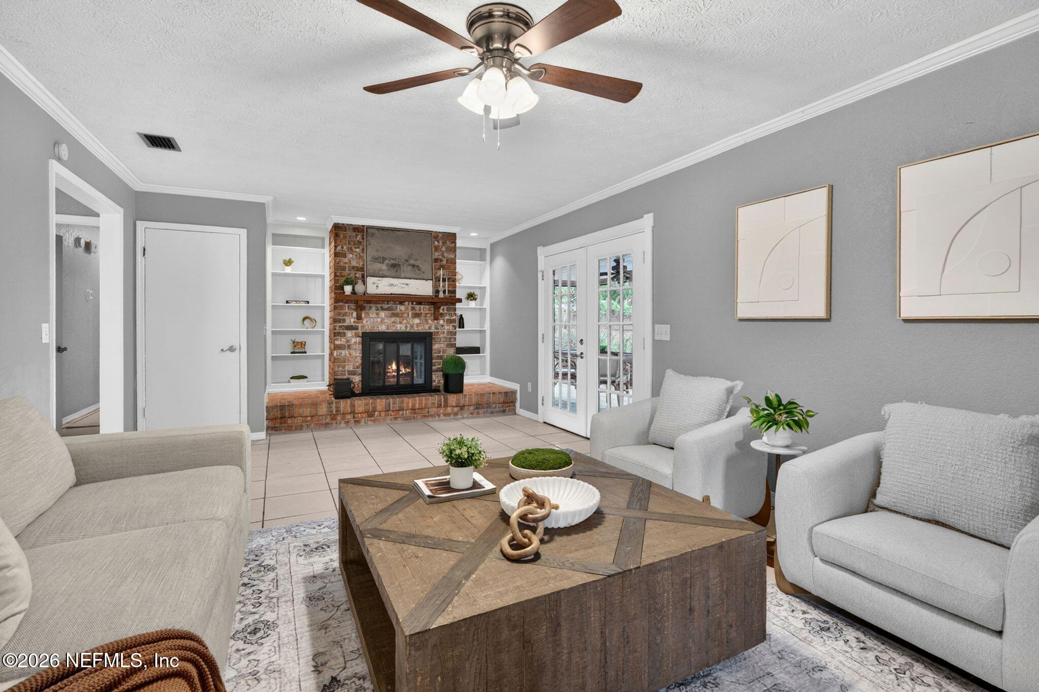 138 Ridgefield Court Orange Park, FL 32065 - Photo 13 of 64 a living room with furniture and a fireplace