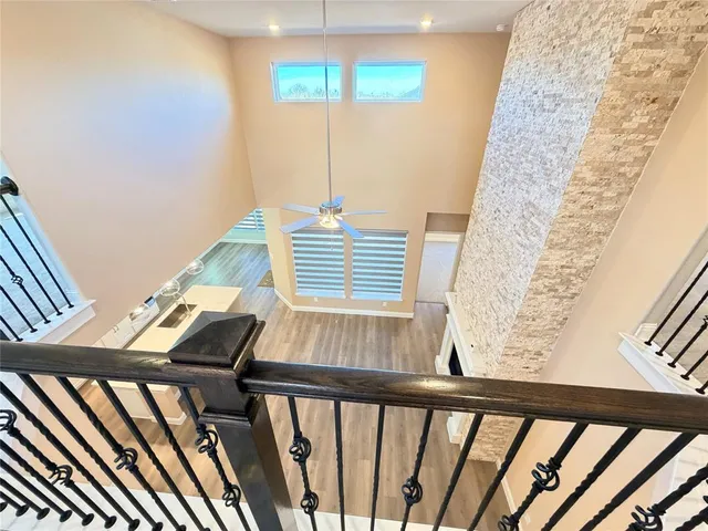 a spacious bathroom with a granite countertop sink a mirror and a bathtub