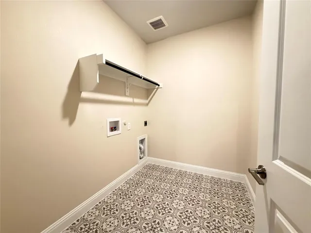 a bathroom with a tub shower sink and mirror