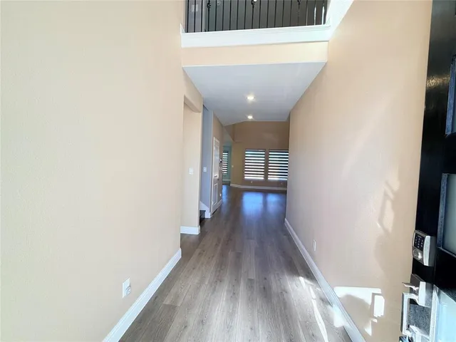 a view of living room with furniture and a wooden floor