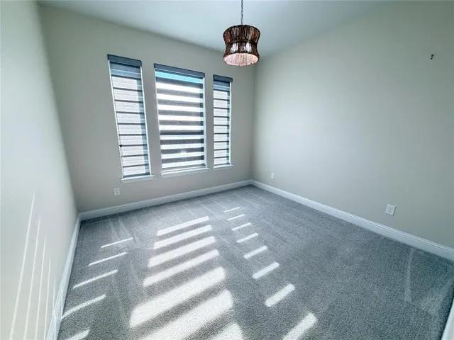 a view of a balcony with furniture