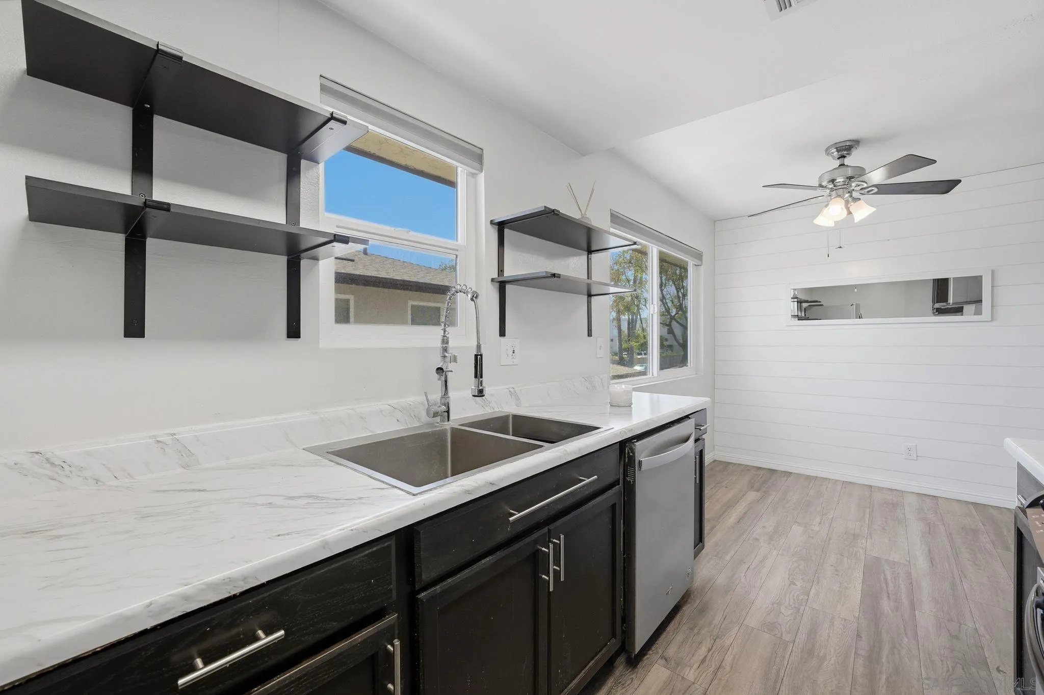 9926 Mission Vega Road, Unit 4 Santee, CA 92071 - Photo 18 of 30 a kitchen with a sink and a refrigerator