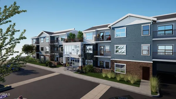 a view of multiple houses with a street