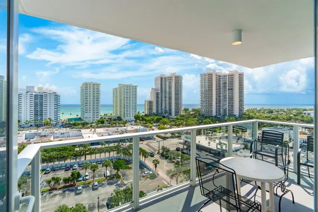 a view of balcony with furniture and city view