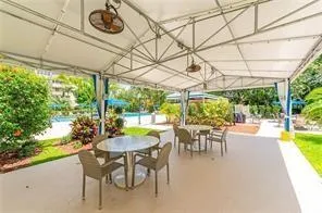 a view of a patio with a table chairs and a table