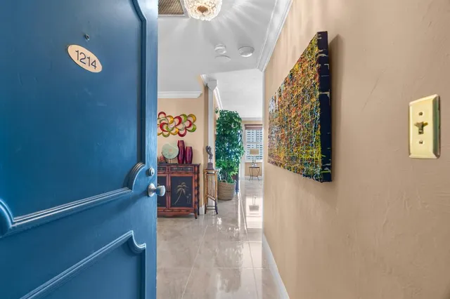 a view of a hallway with seating area