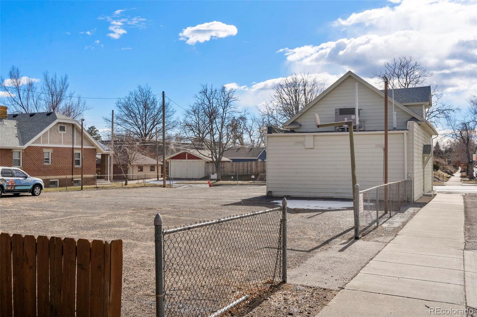 4600 North Clay Street Denver, CO 80211 - Photo 12 of 12 a view of a house with a snow in the yard