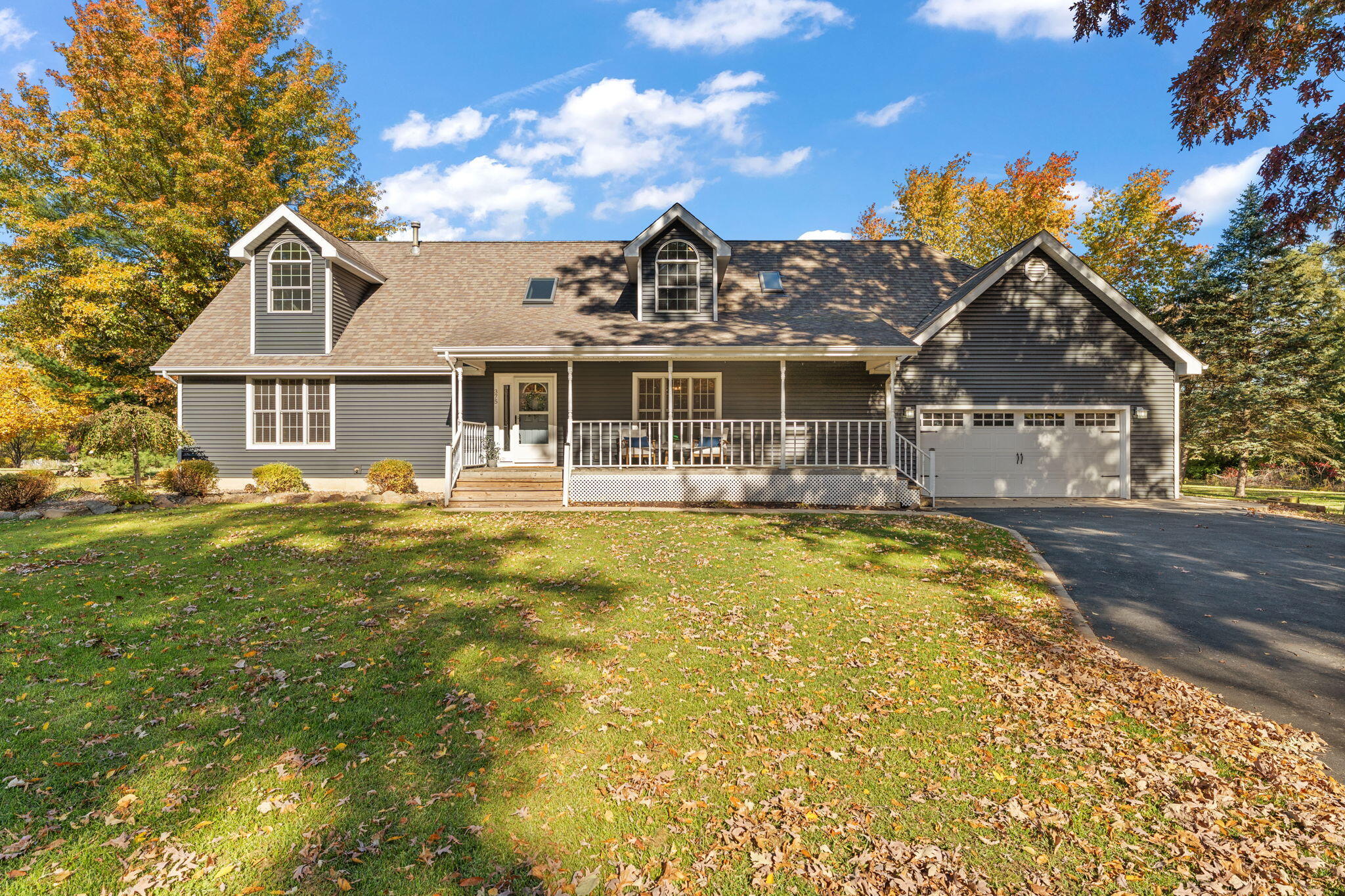 a front view of a house with a small yard