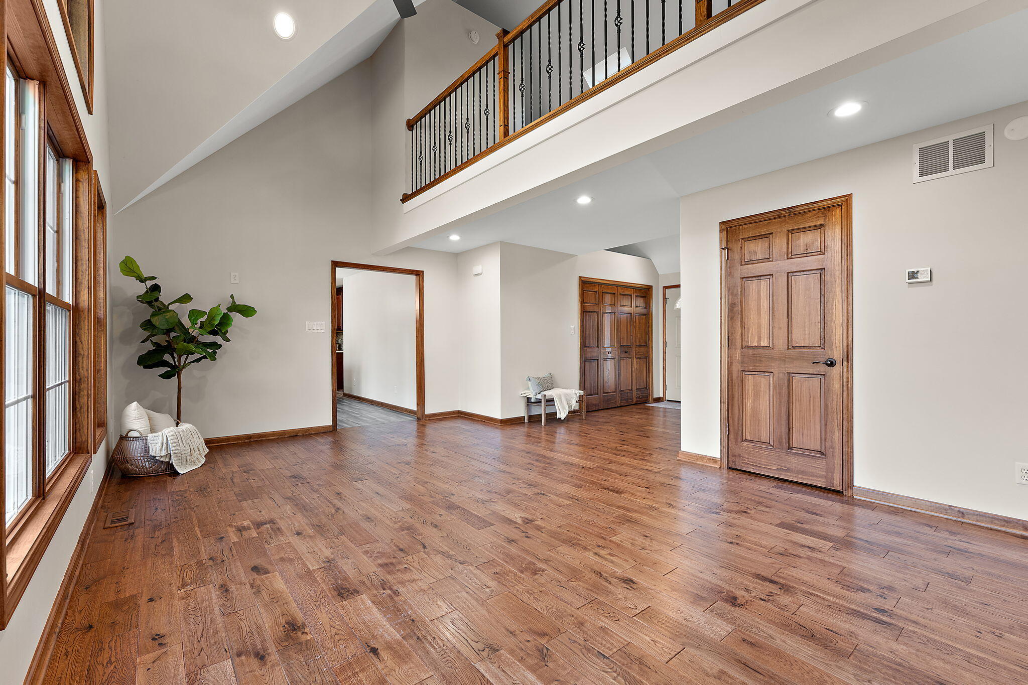 375 Reif Drive Hebron, IN 46341 - Photo 12 of 58 an empty room with wooden floor and windows