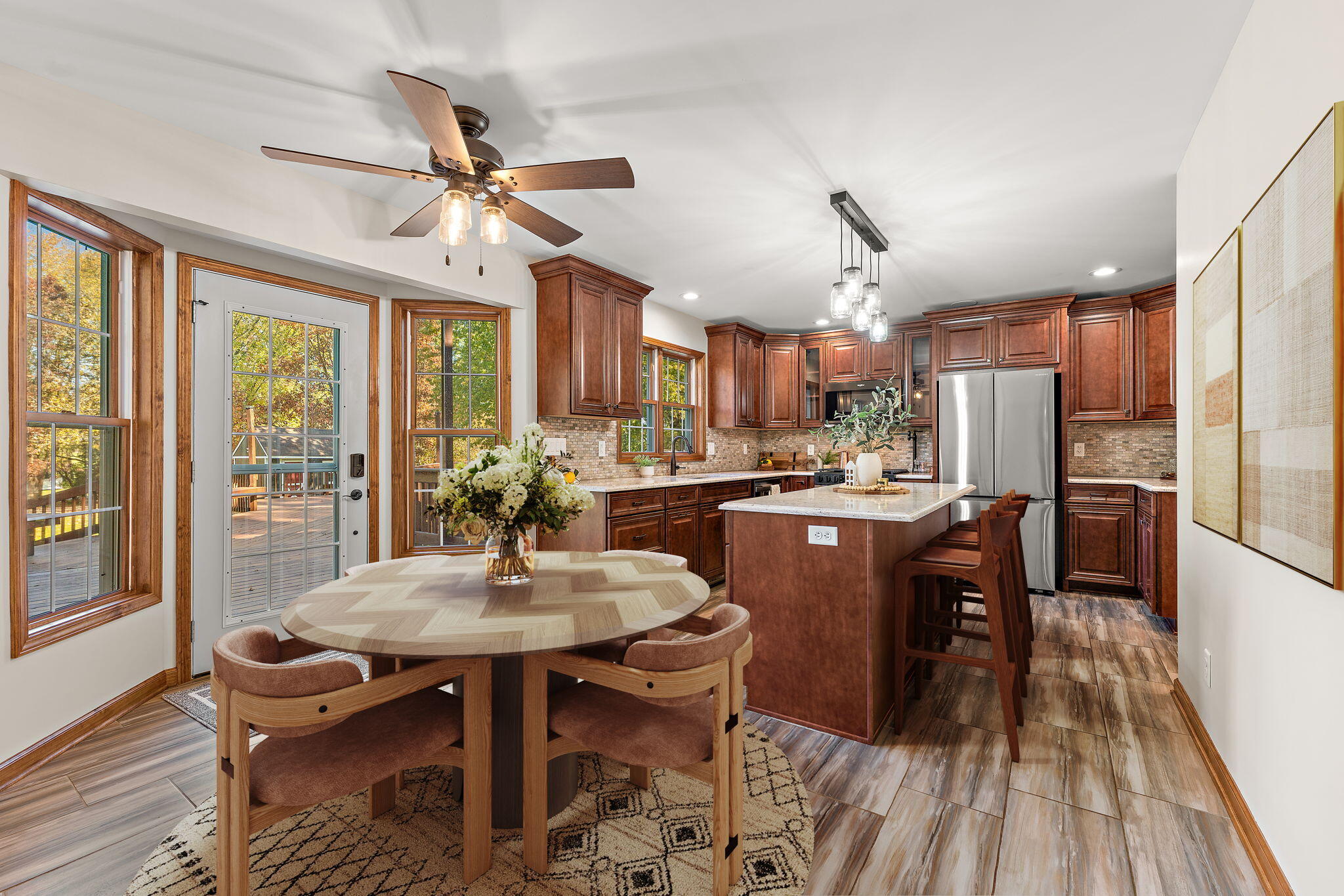375 Reif Drive Hebron, IN 46341 - Photo 15 of 58 a dining room with furniture a chandelier and wooden floor