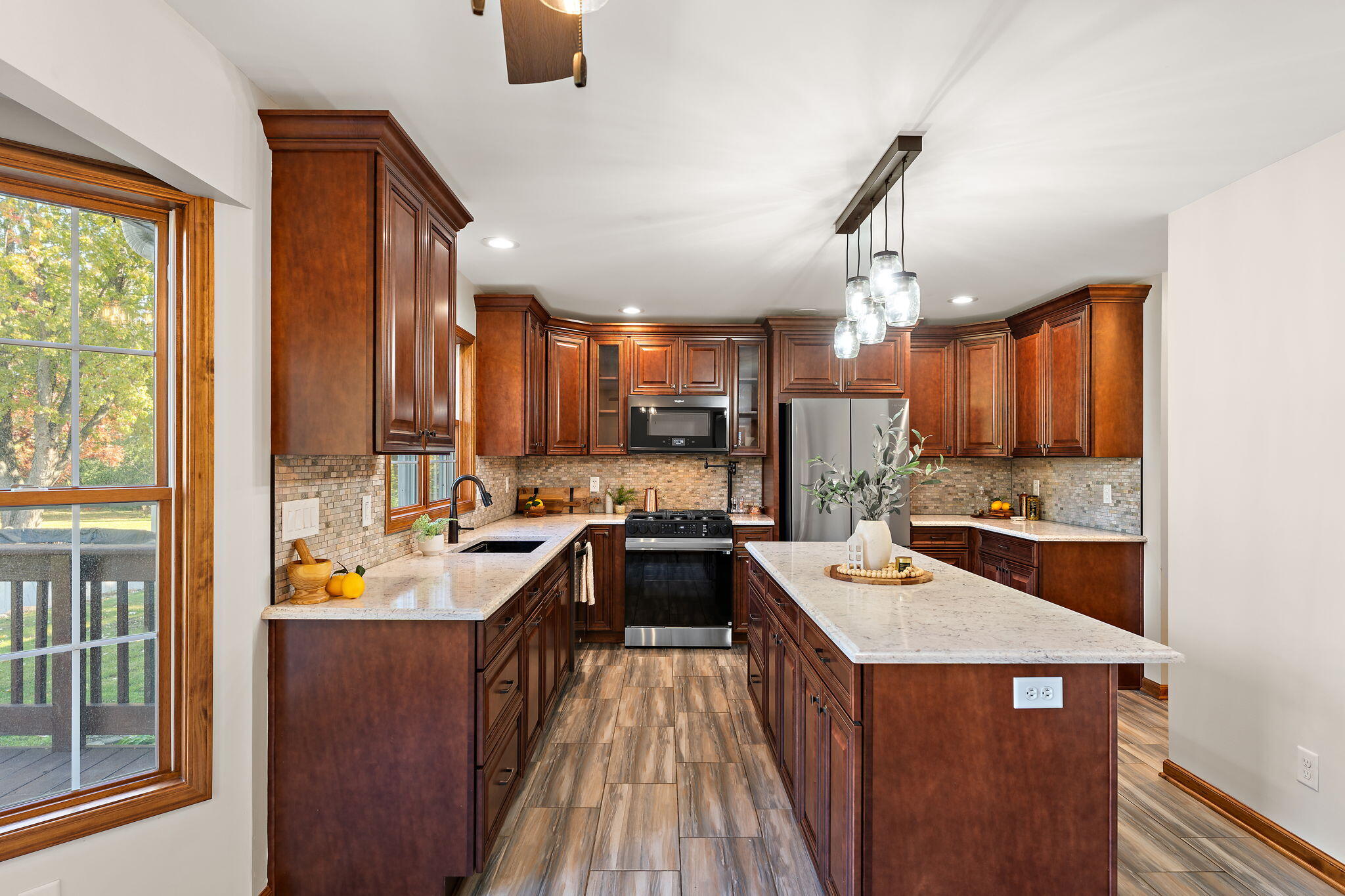 375 Reif Drive Hebron, IN 46341 - Photo 18 of 58 a large kitchen with a large counter top appliances and cabinets