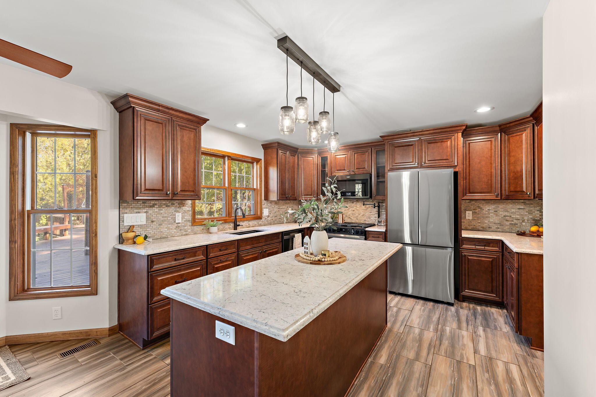 375 Reif Drive Hebron, IN 46341 - Photo 21 of 58 a kitchen with refrigerator cabinets and wooden floor
