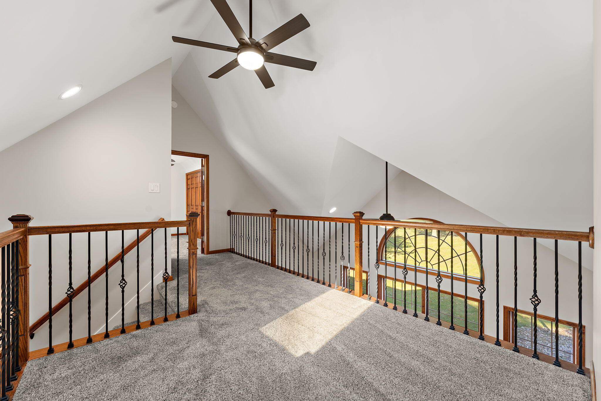 375 Reif Drive Hebron, IN 46341 - Photo 34 of 58 a view of staircase with railing and a chandelier