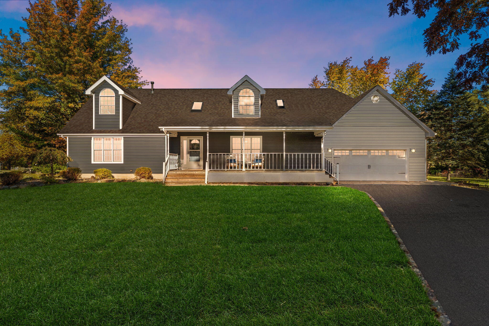 375 Reif Drive Hebron, IN 46341 - Photo 4 of 58 a front view of a house with a yard and garage