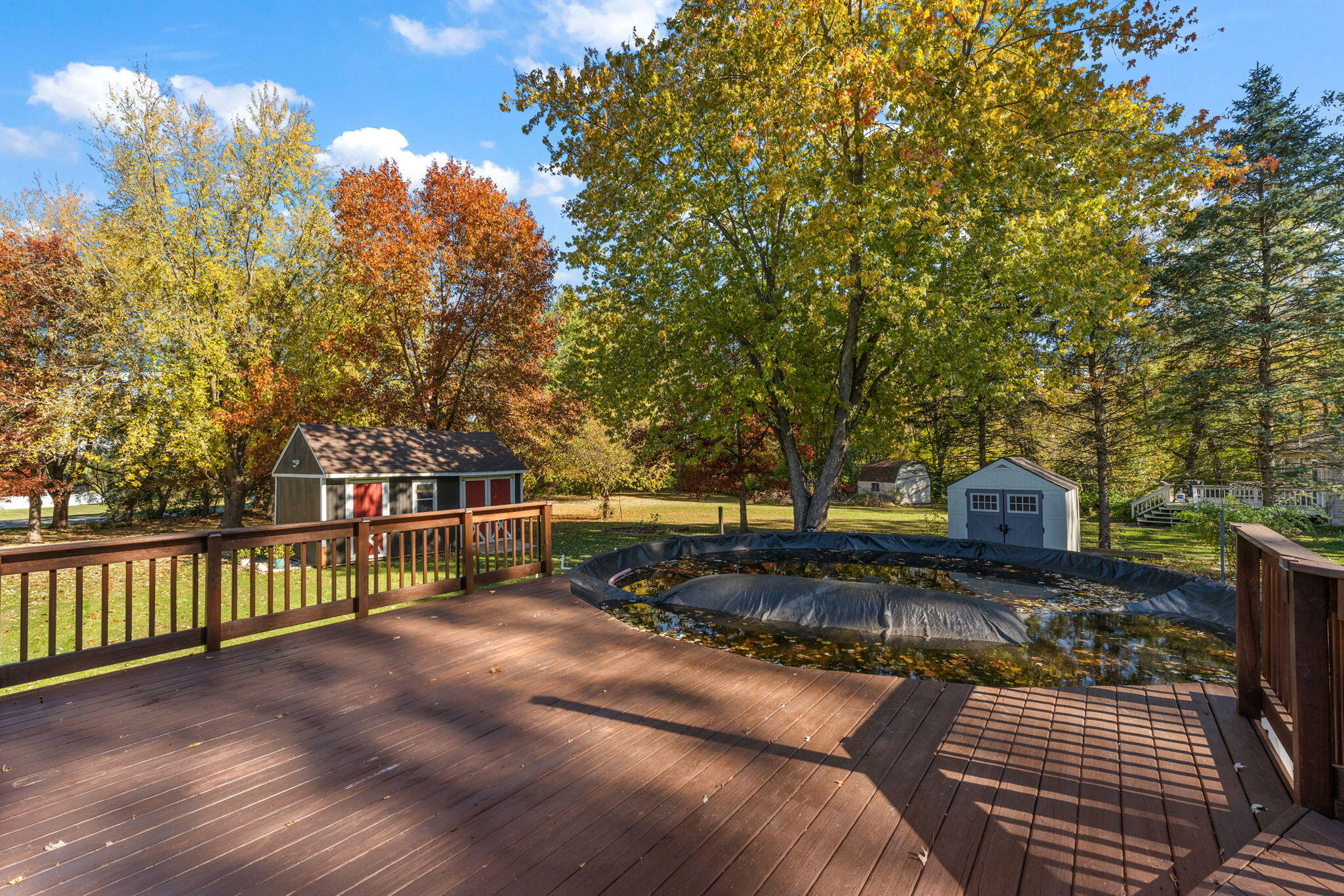 375 Reif Drive Hebron, IN 46341 - Photo 46 of 58 a view of a house with a small yard and wooden fence