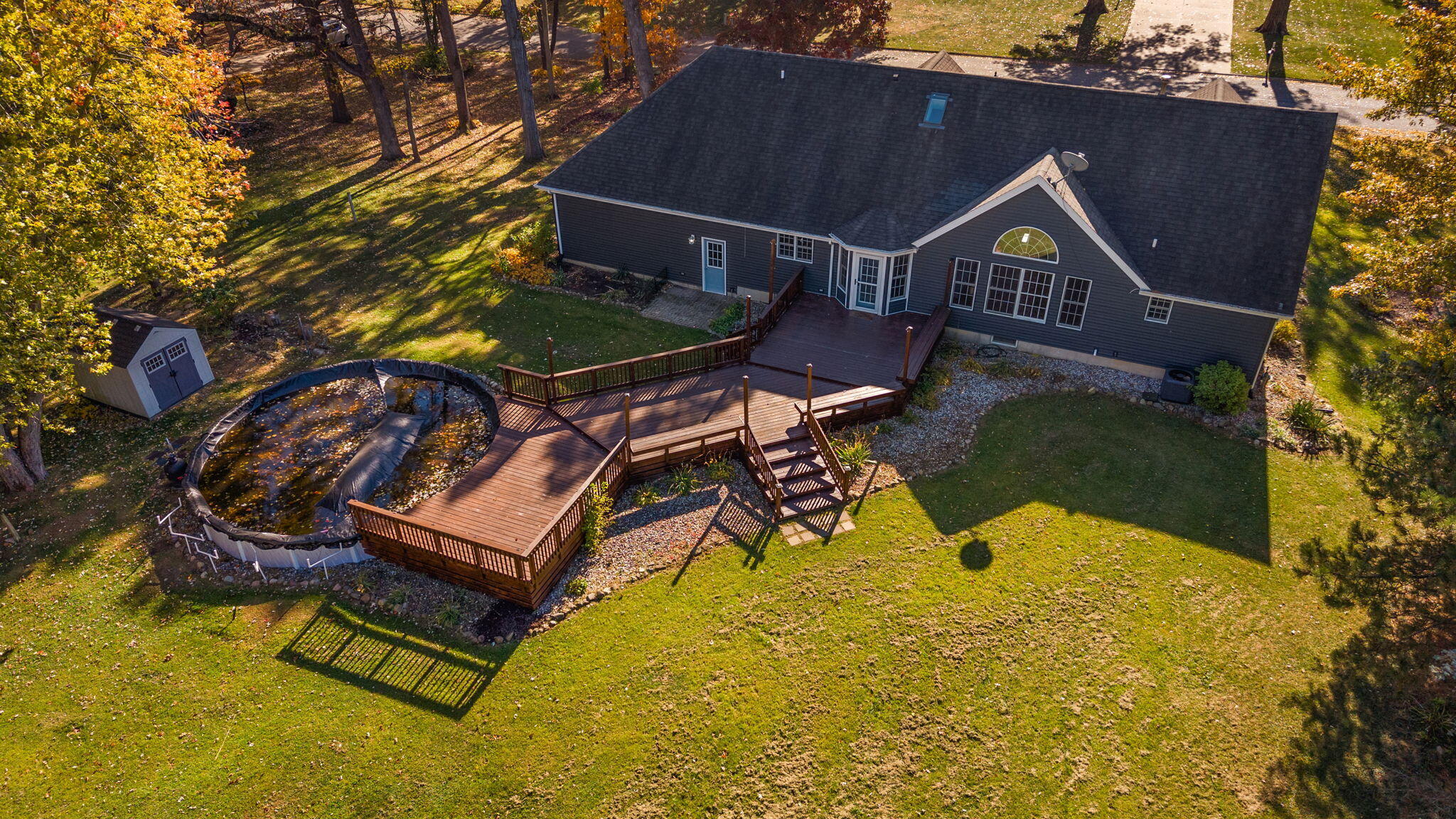 375 Reif Drive Hebron, IN 46341 - Photo 51 of 58 a roof deck with table and chairs under an umbrella