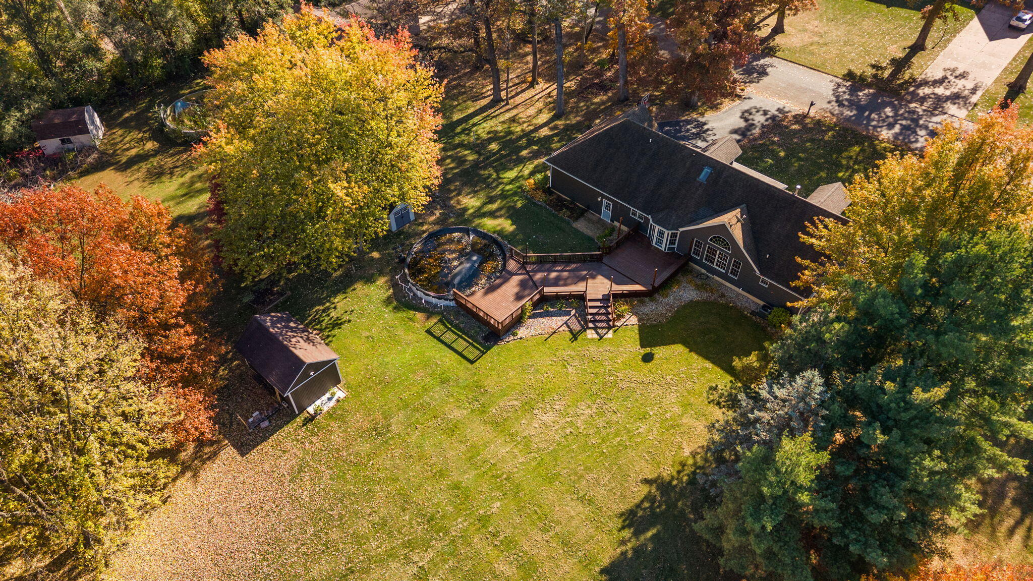 375 Reif Drive Hebron, IN 46341 - Photo 53 of 58 a aerial view of a house with swimming pool and large trees