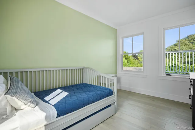 a bedroom with a bed and window