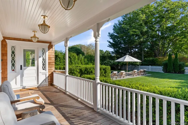 a view of swimming pool with an outdoor seating