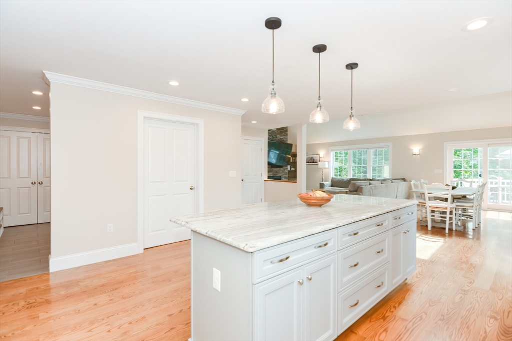 29 Webb Place, Unit A Mansfield, MA 02048 - Photo 12 of 42 a kitchen with a sink and chandelier