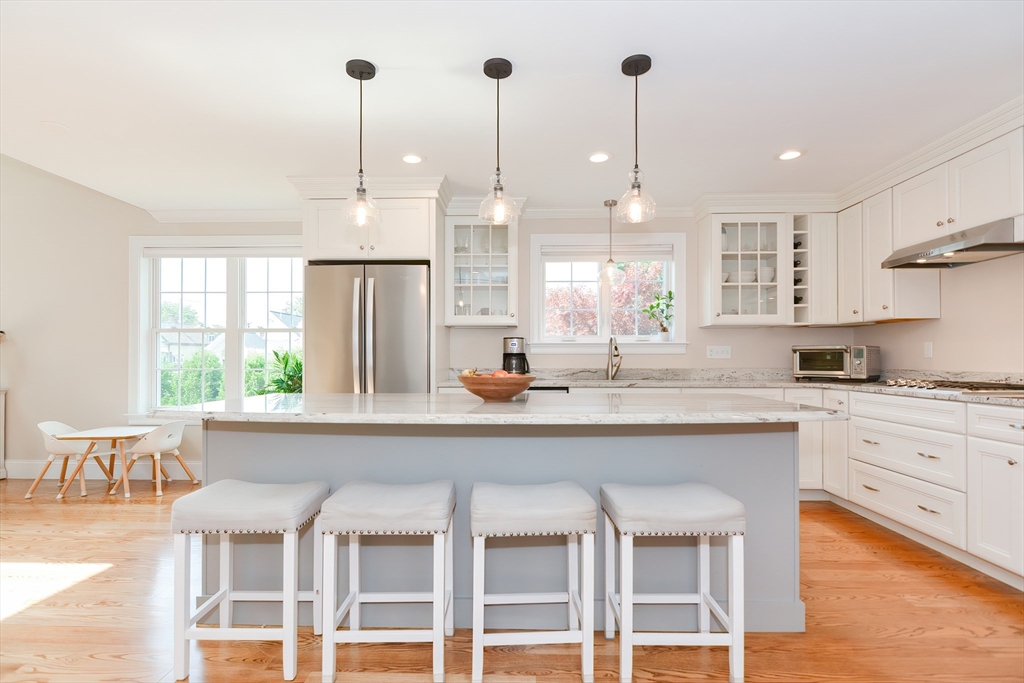29 Webb Place, Unit A Mansfield, MA 02048 - Photo 14 of 42 a kitchen with stainless steel appliances granite countertop a stove and cabinets