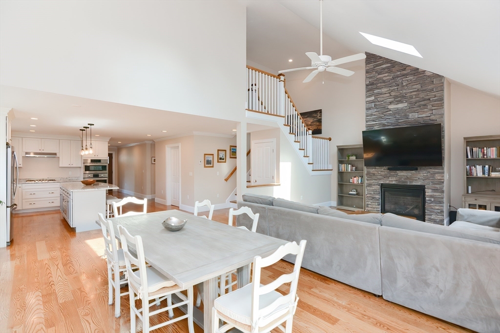 29 Webb Place, Unit A Mansfield, MA 02048 - Photo 19 of 42 a living room with furniture a fireplace and a flat screen tv