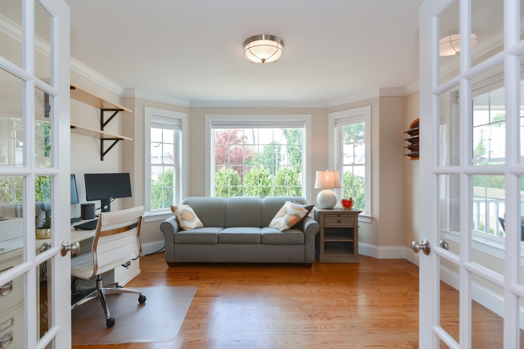 29 Webb Place, Unit A Mansfield, MA 02048 - Photo 20 of 42 a living room with furniture and a large window