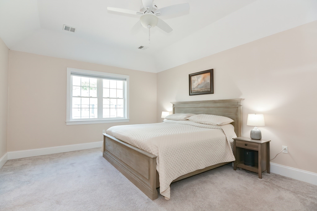 29 Webb Place, Unit A Mansfield, MA 02048 - Photo 26 of 42 a bedroom with a bed and a window