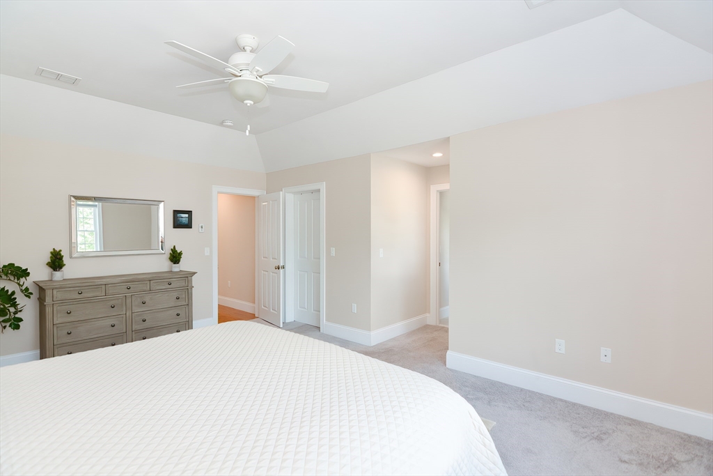 29 Webb Place, Unit A Mansfield, MA 02048 - Photo 27 of 42 a bedroom with a large bed and a dresser