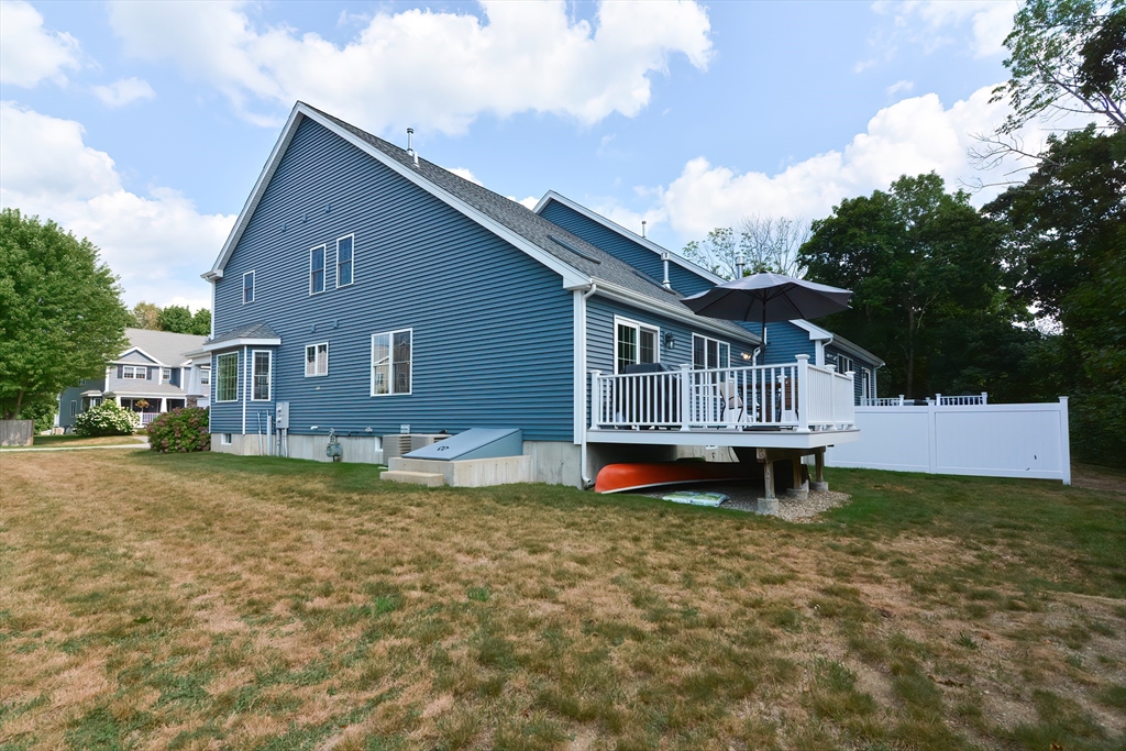 29 Webb Place, Unit A Mansfield, MA 02048 - Photo 36 of 42 a view of a house with a yard and sitting area