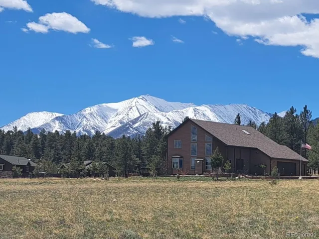 a house with trees in the background
