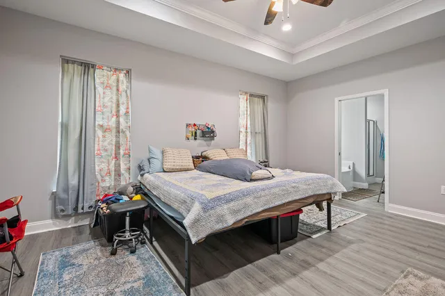 a bathroom with a bathtub and a window