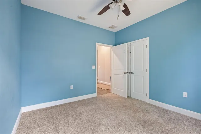 a bathroom with a granite countertop toilet sink and a bathtub