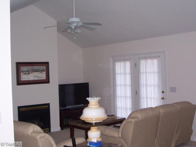 1110 Woodbury Road King, NC 27021 - Photo 2 of 11 Living Room. Living room has cathedral ceilings and fireplace with gas logs. French doors open to huge back deck, a great place for entertaining!!