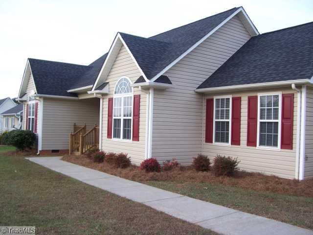 1110 Woodbury Road King, NC 27021 - Photo 10 of 11 Exterior Front. Nice landscape with fresh pine needles.