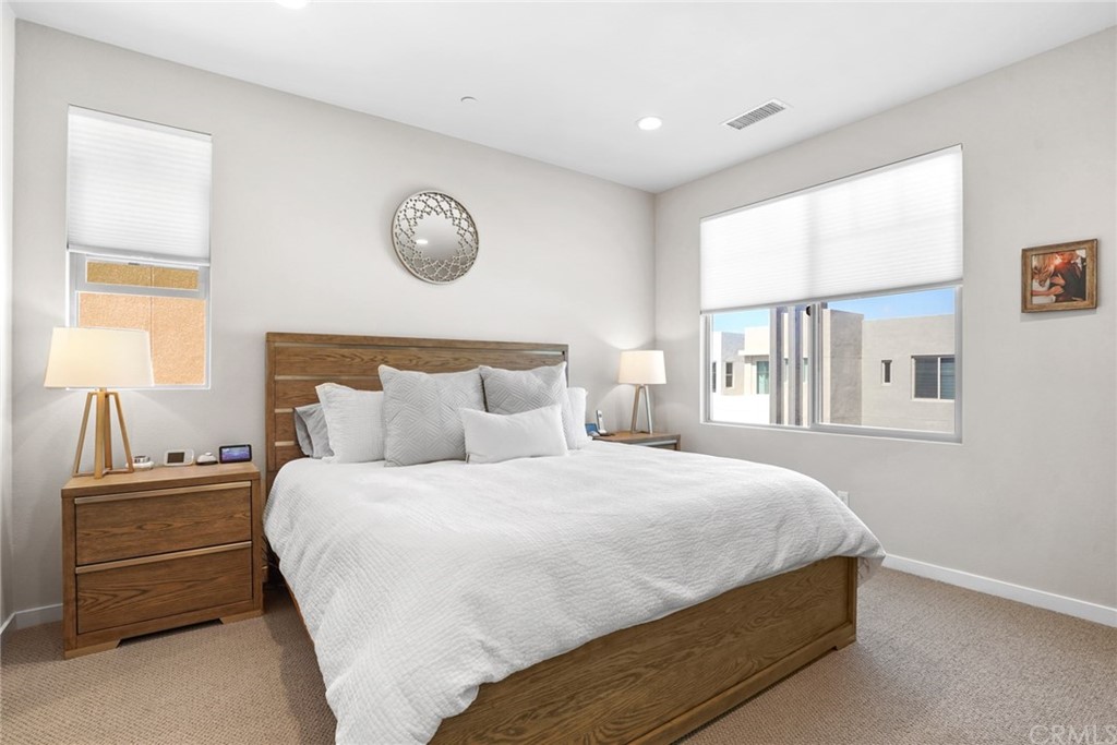237 Magnet Irvine, CA 92618 - Photo 13 of 22 a bedroom with bed and a window