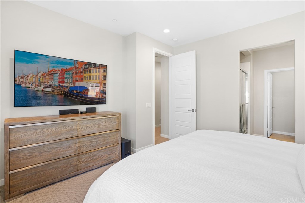 237 Magnet Irvine, CA 92618 - Photo 14 of 22 a bedroom with a bed and a flat screen tv