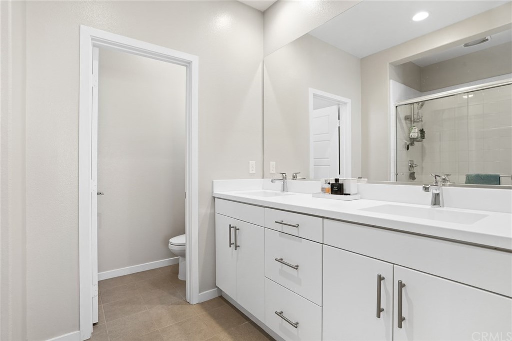 237 Magnet Irvine, CA 92618 - Photo 16 of 22 a bathroom with double sink and a mirror