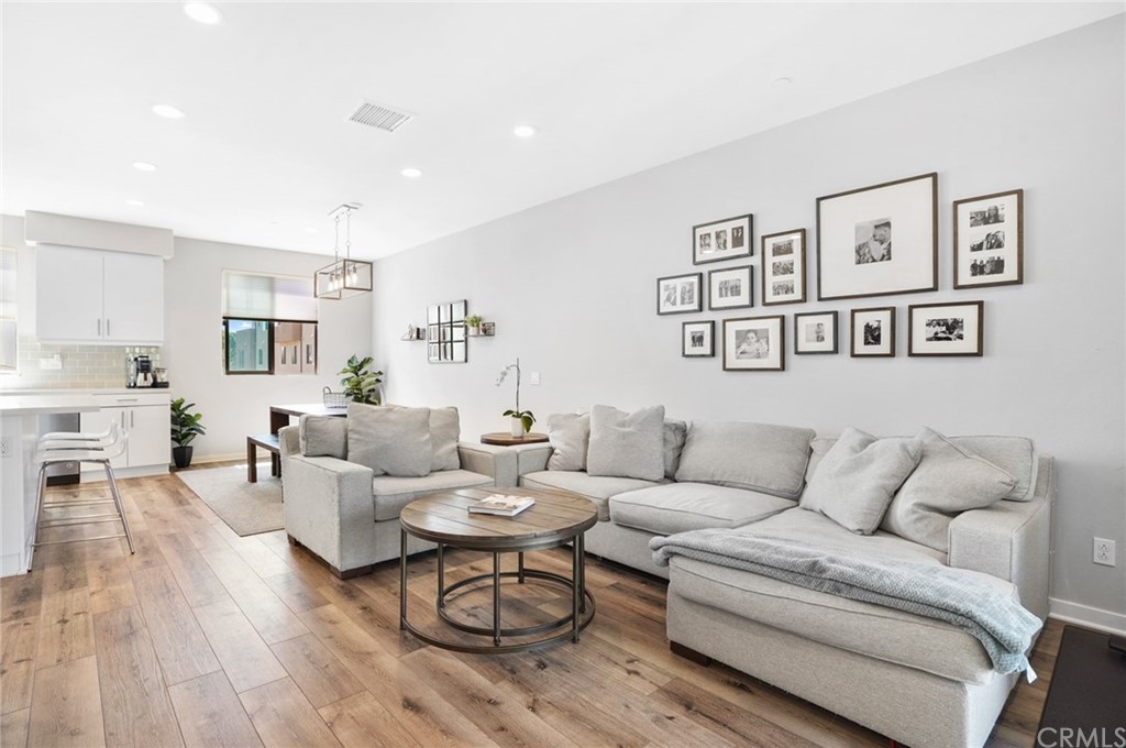 237 Magnet Irvine, CA 92618 - Photo 2 of 22 a living room with furniture and wooden floor