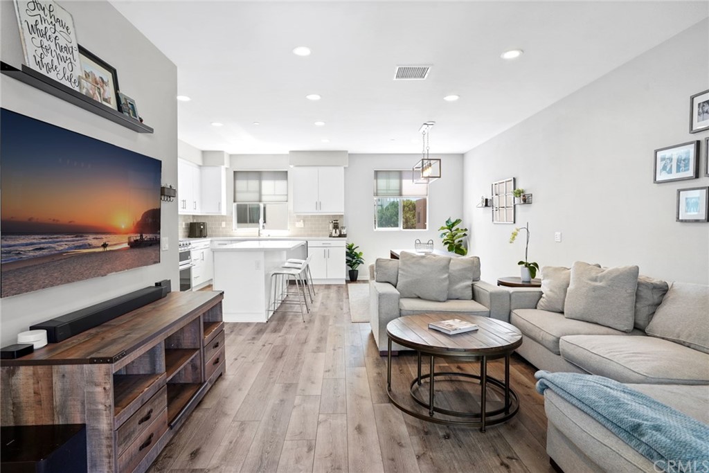237 Magnet Irvine, CA 92618 - Photo 4 of 22 a living room with furniture and a wooden floor