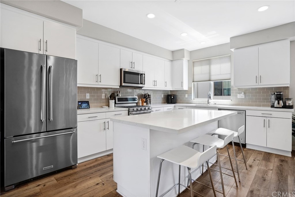 237 Magnet Irvine, CA 92618 - Photo 5 of 22 a kitchen with stainless steel appliances a refrigerator sink and microwave