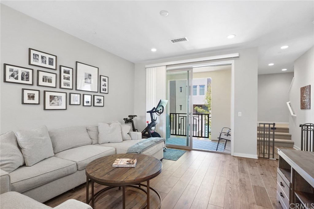 237 Magnet Irvine, CA 92618 - Photo 10 of 22 a living room with furniture and a wooden floor