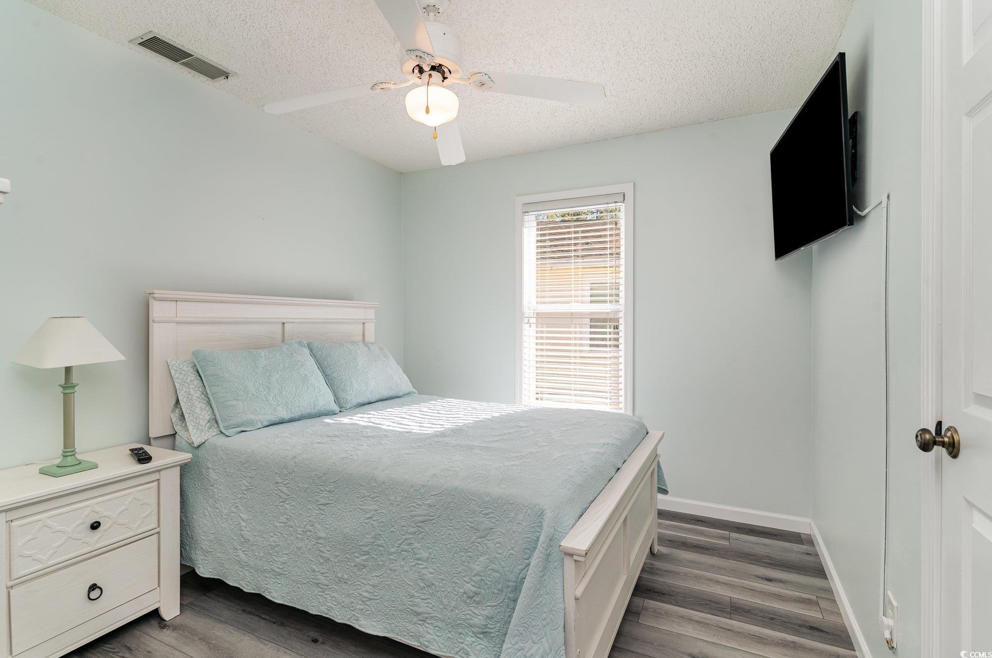 813 Starboard Court Murrells Inlet, SC 29576 - Photo 11 of 17 Bedroom featuring visible vents, a textured ceilin