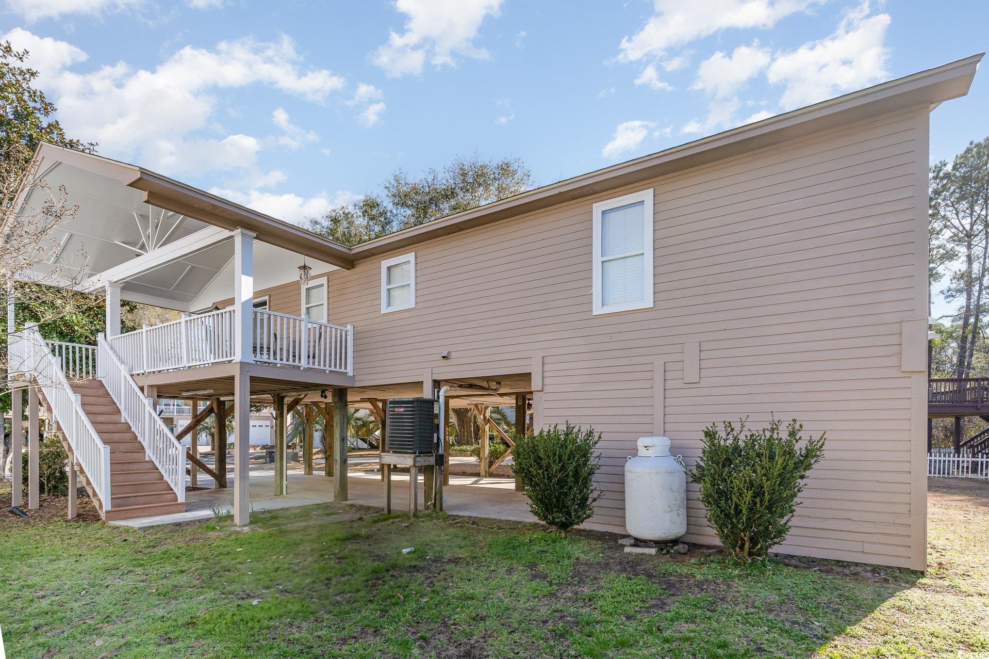 813 Starboard Court Murrells Inlet, SC 29576 - Photo 14 of 17 Rear view of property featuring a patio area, stai